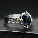 Oval cabochon blue kyanite ring in silver bezel and 4 prong setting with sterling silver texture design band