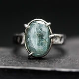 Mint kyanite ring in silver bezel and prongs setting with sterling silver texture flat design band