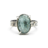 Mint kyanite ring in silver bezel and prongs setting with sterling silver texture flat design band