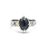Oval cabochon blue kyanite ring in silver bezel and 4 prong setting with sterling silver texture design band