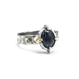 Oval cabochon blue kyanite ring in silver bezel and 4 prong setting with sterling silver texture design band