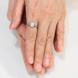 Tiny oval moonstone ring in silver prongs setting with sterling silver hard texture oxidized band