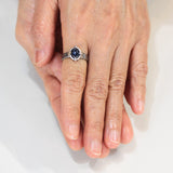 Oval cabochon blue kyanite ring in silver bezel and 4 prong setting with sterling silver texture design band