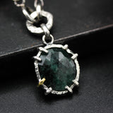 Green Emerald pendant necklace in silver bezel and prongs setting