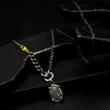 Oval faceted sapphire pendant necklace in silver bezel and prongs setting
