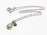 Green kyanite necklace laid flat showing the full sterling silver chain