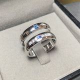 Wedding band set his and hers with blue sapphire and diamonds on white gold in high polished band