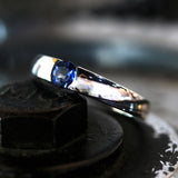 Wedding band ring with blue sapphire on white gold in high polished band