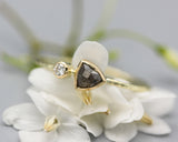 Salt and pepper diamond ring with tiny diamonds on the side and 14k gold texture band
