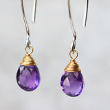 Amethyst February birthstone gemstone drop earrings with long sterling silver dangle and 24k gold plated wrap wire on the faceted gemstone