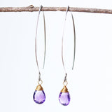 Amethyst February birthstone gemstone drop earrings with long sterling silver dangle and 24k gold plated wrap wire on the faceted gemstone