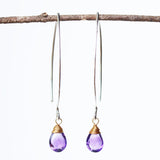 Amethyst February birthstone gemstone drop earrings with long sterling silver dangle and 24k gold plated wrap wire on the faceted gemstone