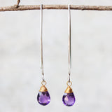 Amethyst February birthstone gemstone drop earrings with long sterling silver dangle and 24k gold plated wrap wire on the faceted gemstone