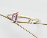 Baguette pink sapphire and diamond ring in bezel and prongs setting with 14k gold texture band