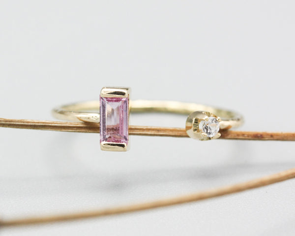 Baguette pink sapphire and diamond ring in bezel and prongs setting with 14k gold texture band