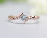 Bypass style ring 14k rose gold with round blue topaz at the center, rose gold ring, rose gold, topaz, blue topaz ring, 14k rose gold