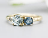14k gold wedding ring with blue topaz, blue sapphire, diamond gemstone in bezel and prongs setting