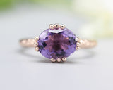 Amethyst cocktail ring in prongs setting with 14k rose gold texture design band