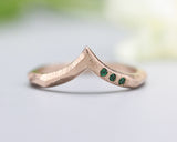 14k Rose gold with geometric design band ring with tiny 3 emerald on the side