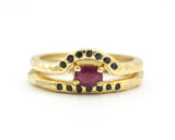 Set of 2 Oval faceted ruby ring in prongs setting with tiny black spinel on 14k gold band set with 14k gold band ring and 7 black spinel