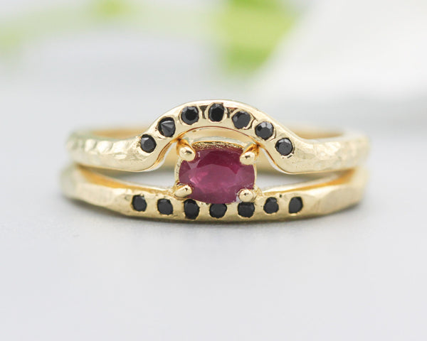 Set of 2 Oval faceted ruby ring in prongs setting with tiny black spinel on 14k gold band set with 14k gold band ring and 7 black spinel