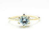 Round faceted  blue topaz ring in prongs setting with 14k gold twist band