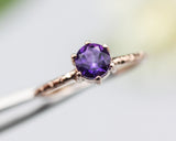 Round faceted Amethyst ring in prongs setting with 14k rose gold texture design band