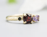 14k gold wedding ring with Garnet, amethyst, black spinel gemstone in bezel and prongs setting.