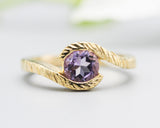 Bypass style ring 14k gold line texture design with round faceted Amethyst at the center