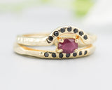 Set of 2 Oval faceted ruby ring in prongs setting with tiny black spinel on 14k gold band set with 14k gold band ring and 7 black spinel