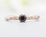 Round faceted garnet ring in prongs setting with tiny diamonds on 14k Rose gold texture design band