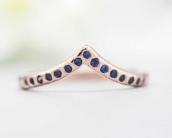 14k rose gold with hammer design texture design band ring with tiny 15 blue sapphire on the center