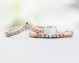 Set of 2 Oval faceted blue topaz ring with tiny diamonds on 14k Rose gold band set with 14k rose gold ring with 15 diamond on the center