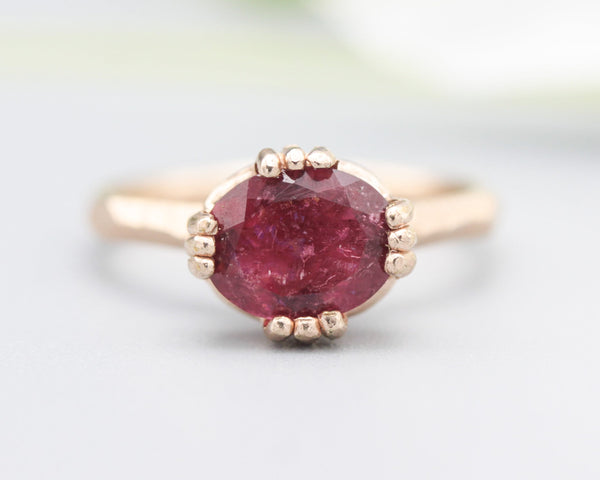 Pink tourmaline cocktail ring in prongs setting with 14k rose gold geometric design band