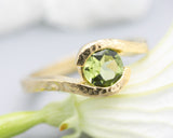 Bypass style ring 14k gold wood texture design with round faceted Peridot at the center