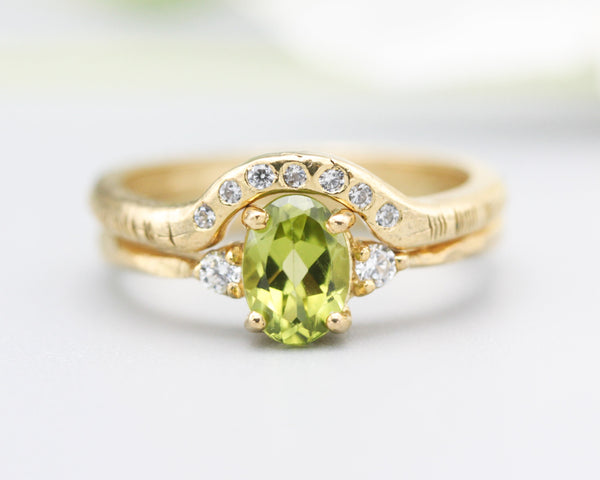 Set of 2 Oval faceted peridot ring with tiny round diamonds side set with 14k gold band ring with tiny 7 diamond on the center