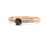 Round faceted garnet ring in prongs setting with tiny diamonds on 14k Rose gold texture design band