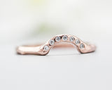14k rose gold with geometric design band ring with tiny 7 diamond on the center