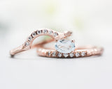 Set of 2 Oval faceted blue topaz ring with tiny diamonds on 14k Rose gold band set with 14k rose gold ring with 7 diamond on the center