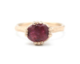 Pink tourmaline cocktail ring in prongs setting with 14k rose gold geometric design band