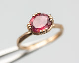 Pink tourmaline cocktail ring in prongs setting with 14k rose gold geometric design band