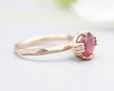 Pink tourmaline cocktail ring in prongs setting with 14k rose gold geometric design band