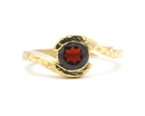 Bypass style ring 14k gold hammer texture design with round faceted Garnet at the center