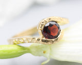 Bypass style ring 14k gold hammer texture design with round faceted Garnet at the center