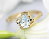 Oval Blue topaz ring and twin side set pyrite with 14k gold geometric texture band