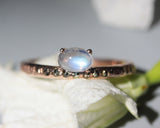 Oval Moonstone ring in prongs setting with tiny pyrite on 14k Rose gold texture design band