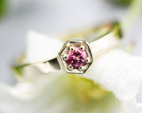 Round pink tourmaline ring in pave setting with 14k gold high polished flat band