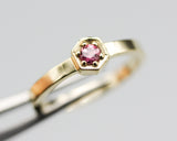 Round pink tourmaline ring in pave setting with 14k gold high polished flat band