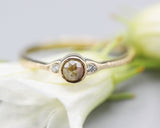 Natural round brown/grey Diamond with tiny round diamonds side set with 14k gold texture band