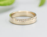 14k gold wedding ring 4 mm with diamond that extends half of the way around the high polished band
